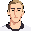 front-facing face reference portrait based on the uploaded photo. young light-skinned male, short light brown hair, long slim face, defined jaw, dark eyebrows, calm slight smile, simple readable eyes, clean 2d game portrait style, centered head and neck o