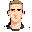 front-facing face reference image only, based on the uploaded face photo. young light-skinned male, short light brown hair slightly darker, long slim face, defined jaw, dark eyebrows, simple readable eyes, calm slight smile, natural ear size, clean 2d gam