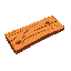 it's a woodden plank that is 63 pixels long and 16 pixels wide, it's bright brown color with slightly darker separation lines, its has some dark spots
