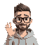 a man with short grade 0 buzz cut hair with thick black glasses, no beard, in a light gray hoody waving