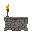 empty torch holder on stone wall