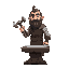 medieval blacksmith holding a hammer and a sword on anvil