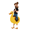 yellow duck mount in 3/4 view facing right, shaded body, white eye, orange beak. rider is a bearded man with brown hair, black shirt, blue pants, black shoes, holding neck.