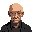 a bald old central asian man in his mid 70s with no hair tells his life story, his eyes are not visible, the image is grainy and unsettling
