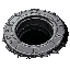 an open round sewer drain, the heavy round metal cover is pushed aside. looking from the side of the hole