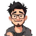 man with medium length dark hair, slightly spiky, short beard, glasses, cheesy smile, sitting in coffee shop with 