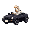 blonde guy with white hoodie driving in a black car, side view