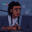 a dev on his computer, looking focused, he has braids