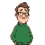 a tall, heavyset man with receding hair, a broad face, glasses, a green sweater, and a silly smile.